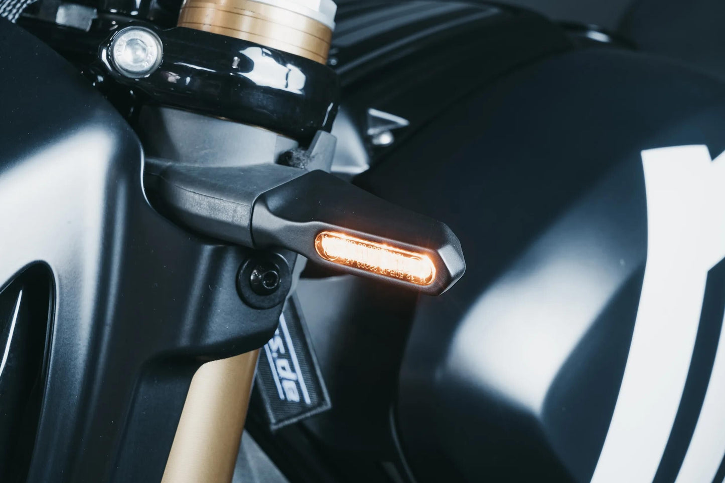 Indicateur de direction du motoïsme ressort