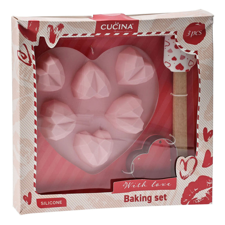 Set de pâtisserie comprenant un moule à gâteau, une spatule et un emporte-pièce