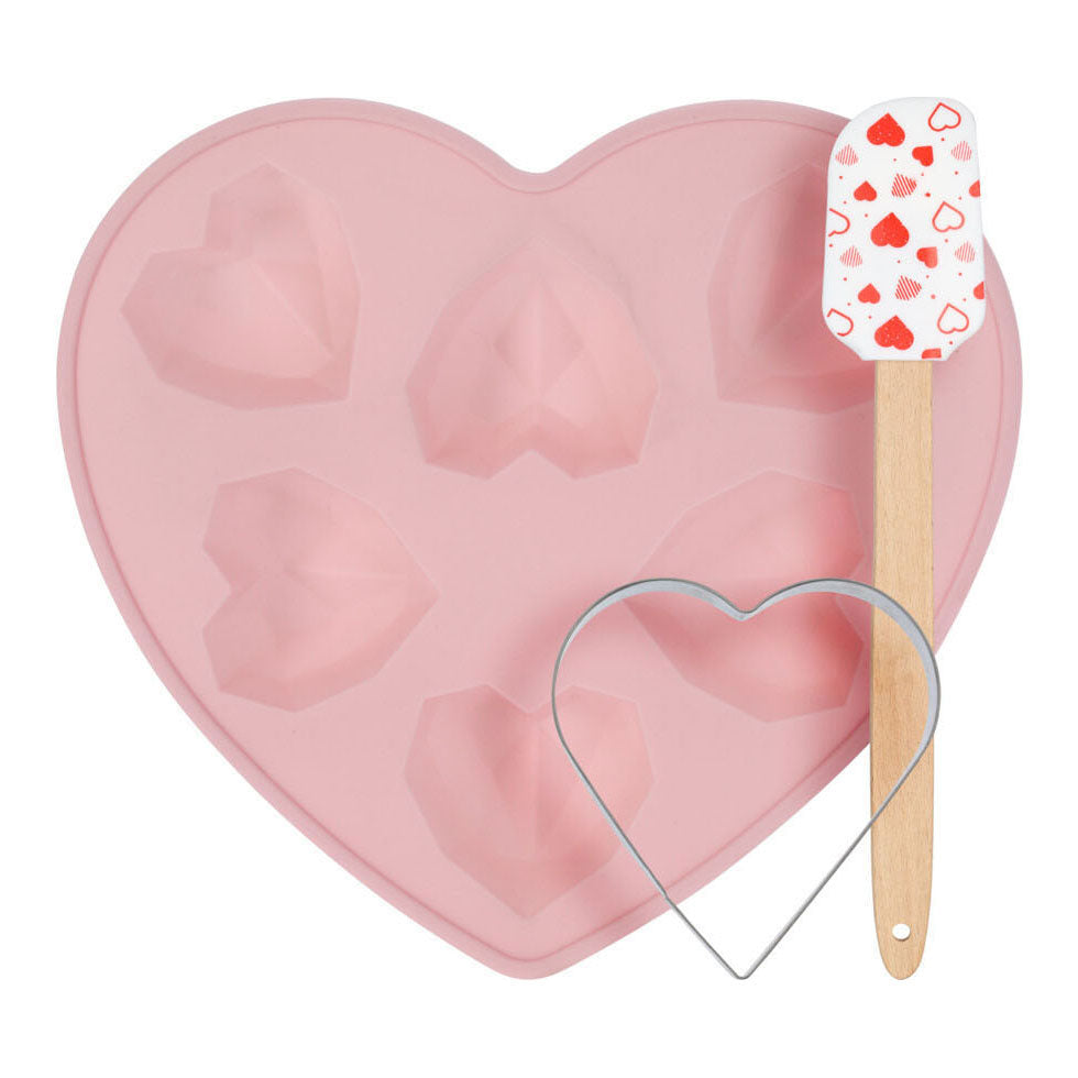 Set de pâtisserie comprenant un moule à gâteau, une spatule et un emporte-pièce