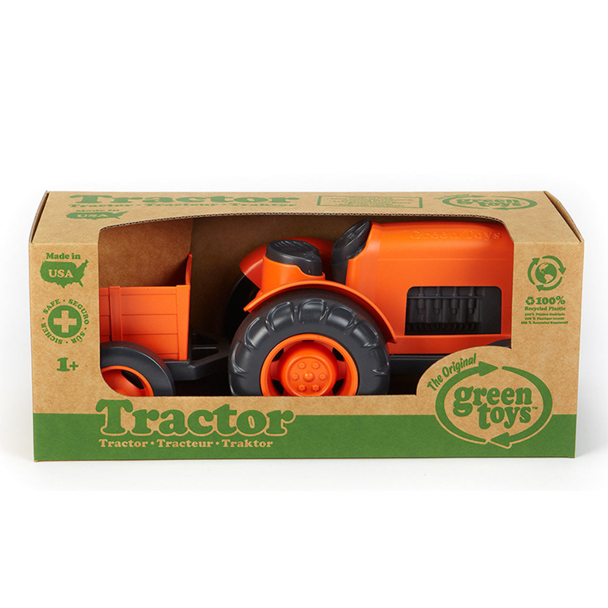 Tracteur de jouets verts avec remorque orange