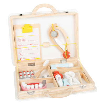 Petit médecin en bois et dentiste 2in1 placé dans une valise