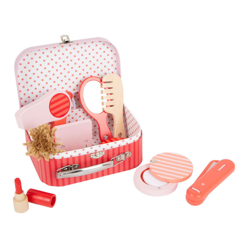 Makeuvré de jeu rétro en bois de petit pied dans une valise