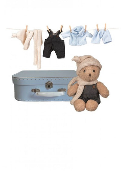 Egmont Morris avec des vêtements dans une valise. 29x