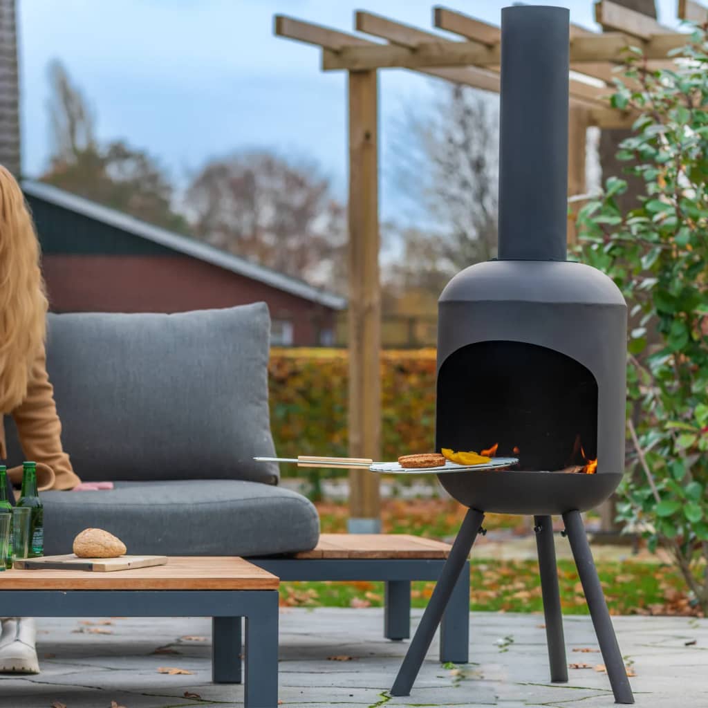 Foyer au jardin rouge feu rouge avec grill rack fuego groot noir