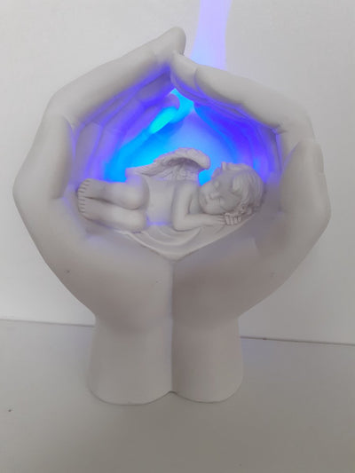 Chérubin endormi dans les mains avec LED