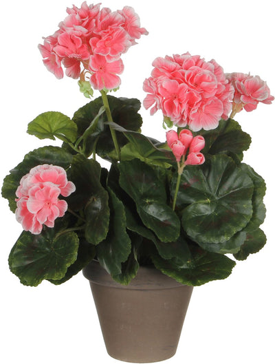 Pêche au géranium de plante artificielle dans le pot gris