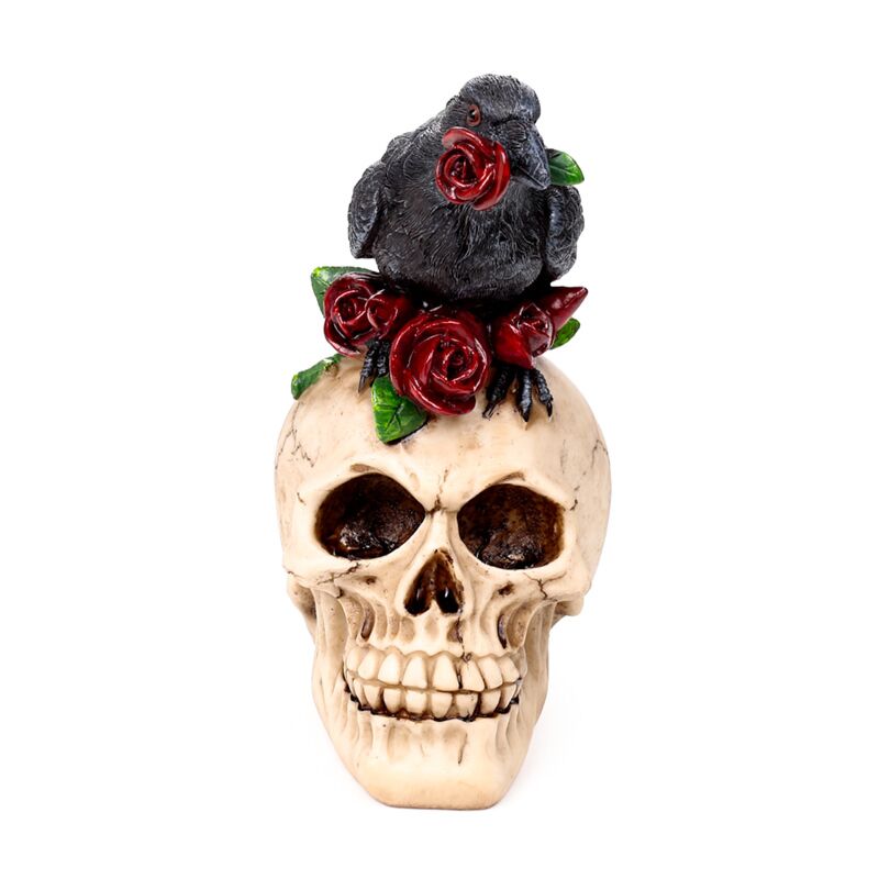 Crâne avec des roses rouges corbeau