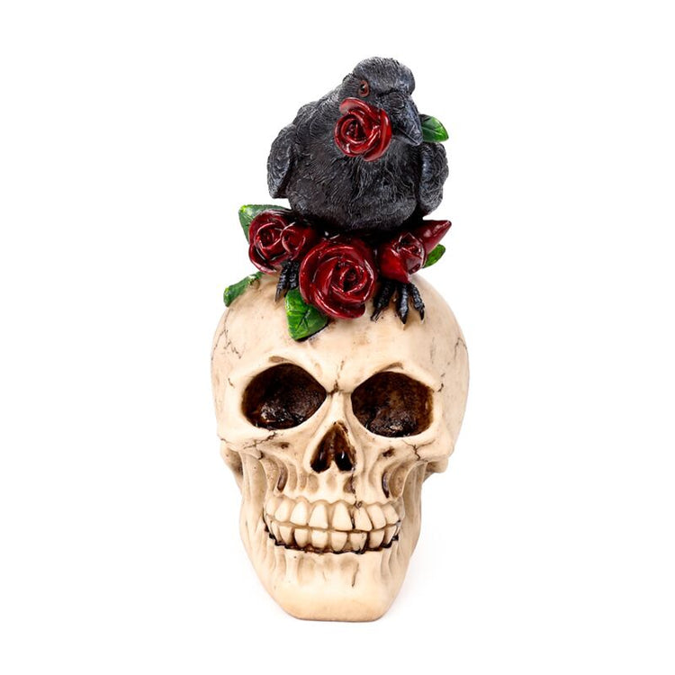 Crâne avec des roses rouges corbeau