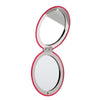 Christmas pousse le miroir de maquillage compact sur le chat