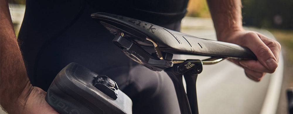 Support de selle à base de poussée Fidlock